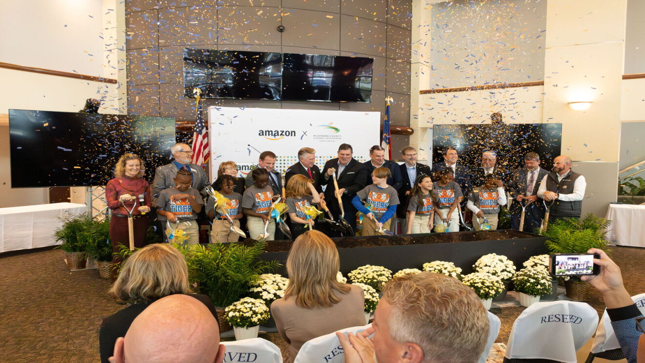 Amazon and local officials celebrate groundbreaking with children in STEM shirts