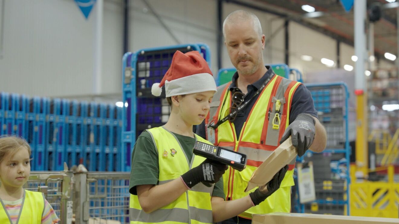 A kid scanning Amazon package