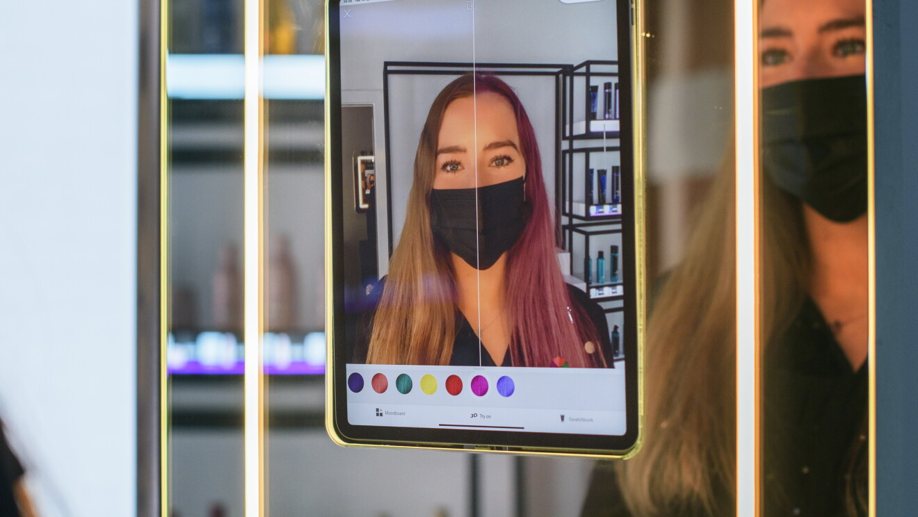 woman using AR in the Amazon Salon, London