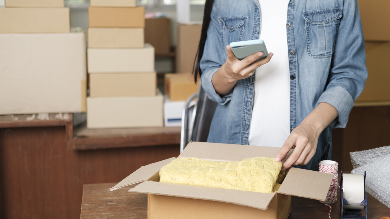 Online business owner preparing product to customer
