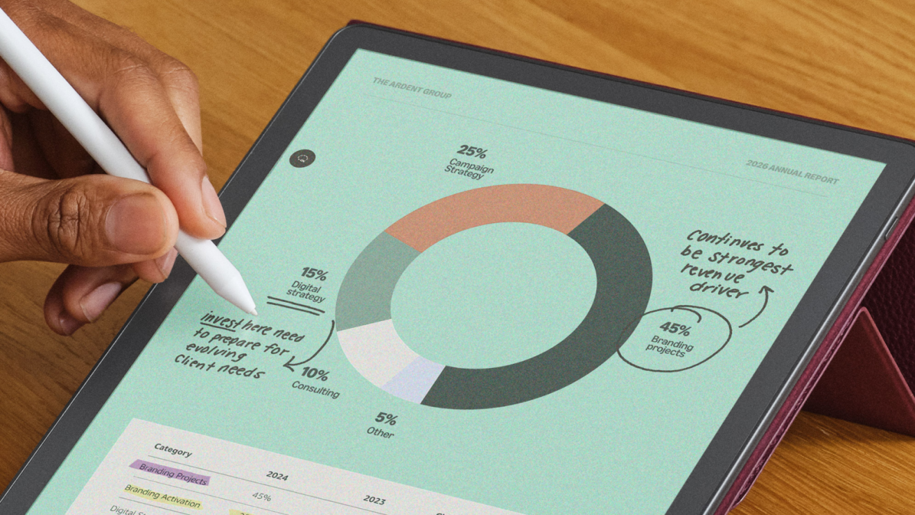 A person annotating a diagram using a digital pen on a Kindle device