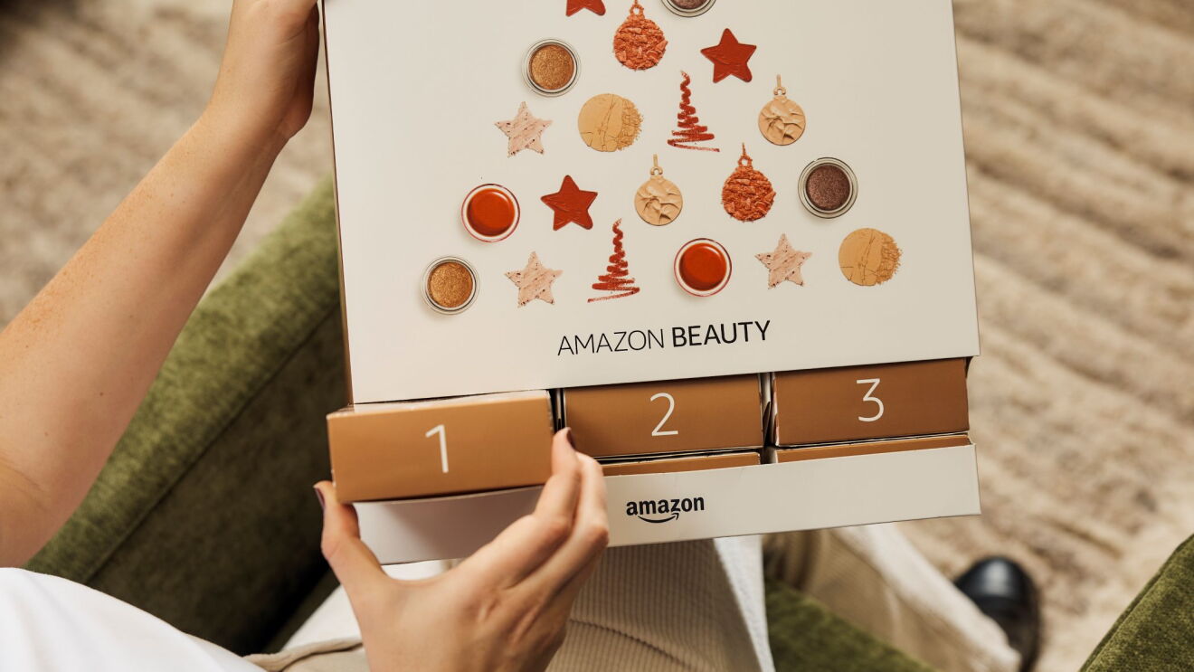 Person pulling out the first box from the 2025 Amazon beauty advent calendar