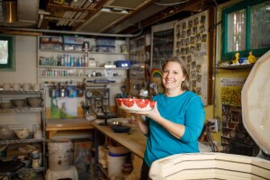 Sarah Bak, of Sarah Bak Pottery, holding a bowl she created.