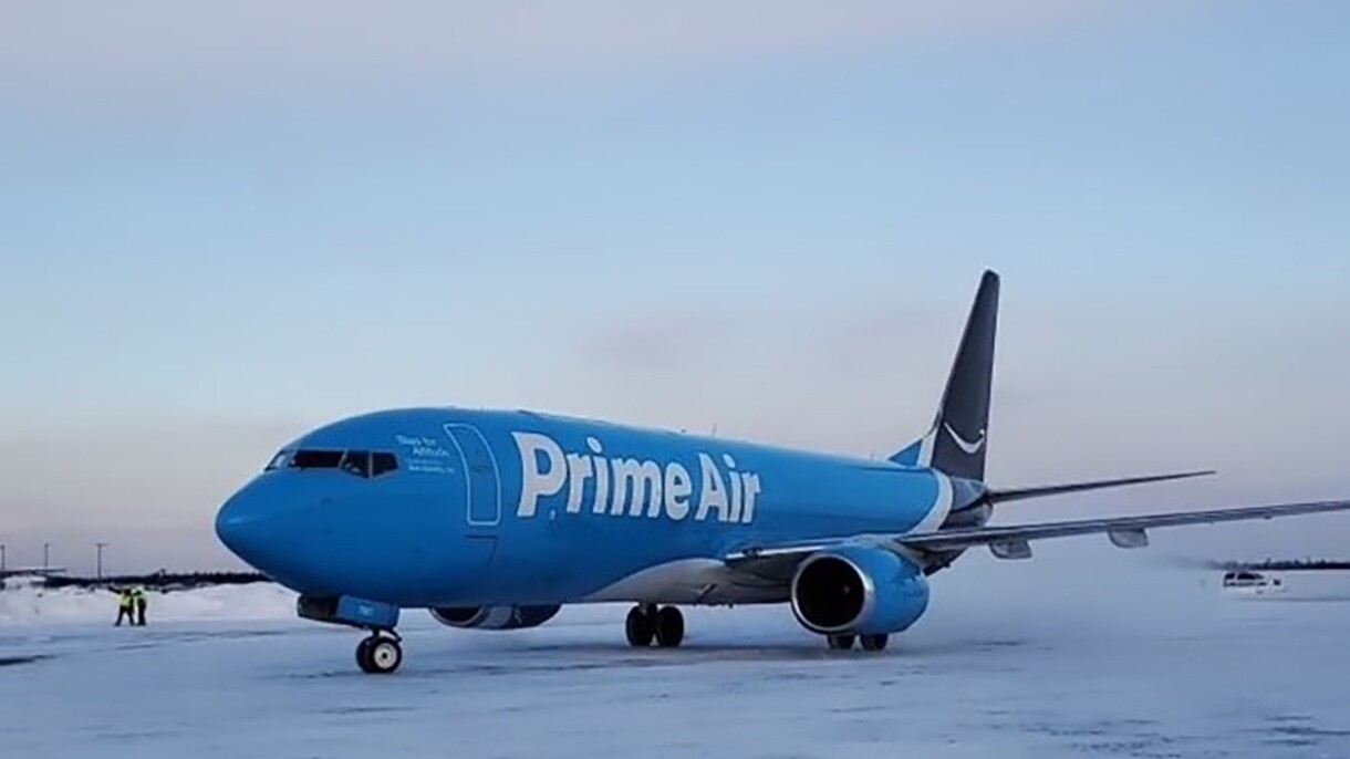 A Prime Air plane on a wintery tarmac in Alaska