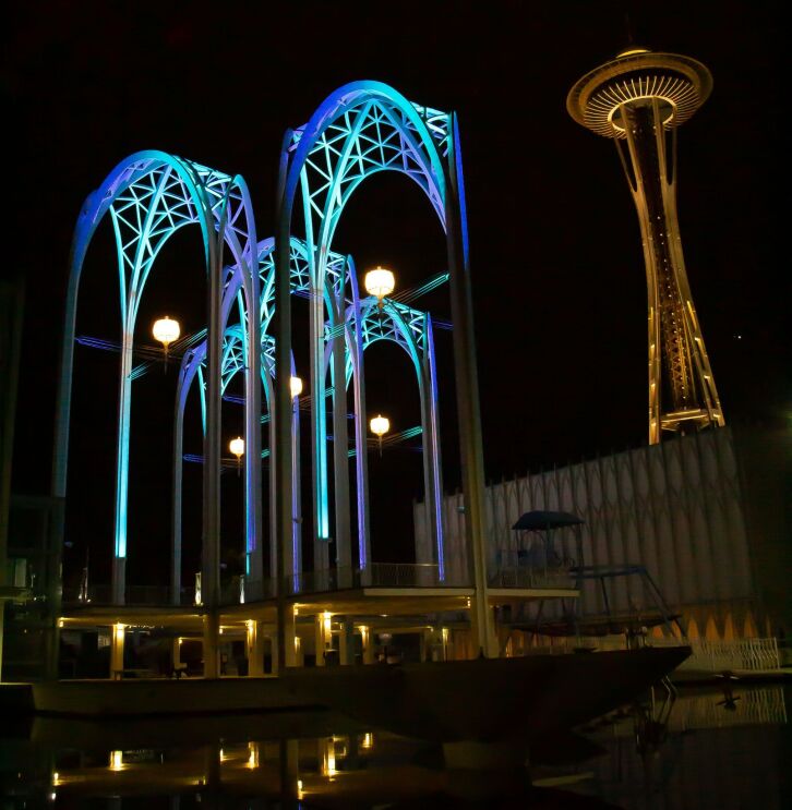 Photos of the Pacific Science Center (PacSci) arches with blue lights at night