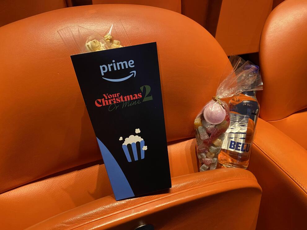 Snacks on an orange seat at the Your Christmas or Mine 2 screening