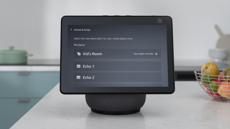 An image of an Echo Show device showing the Devices and Groups settings on the screen.