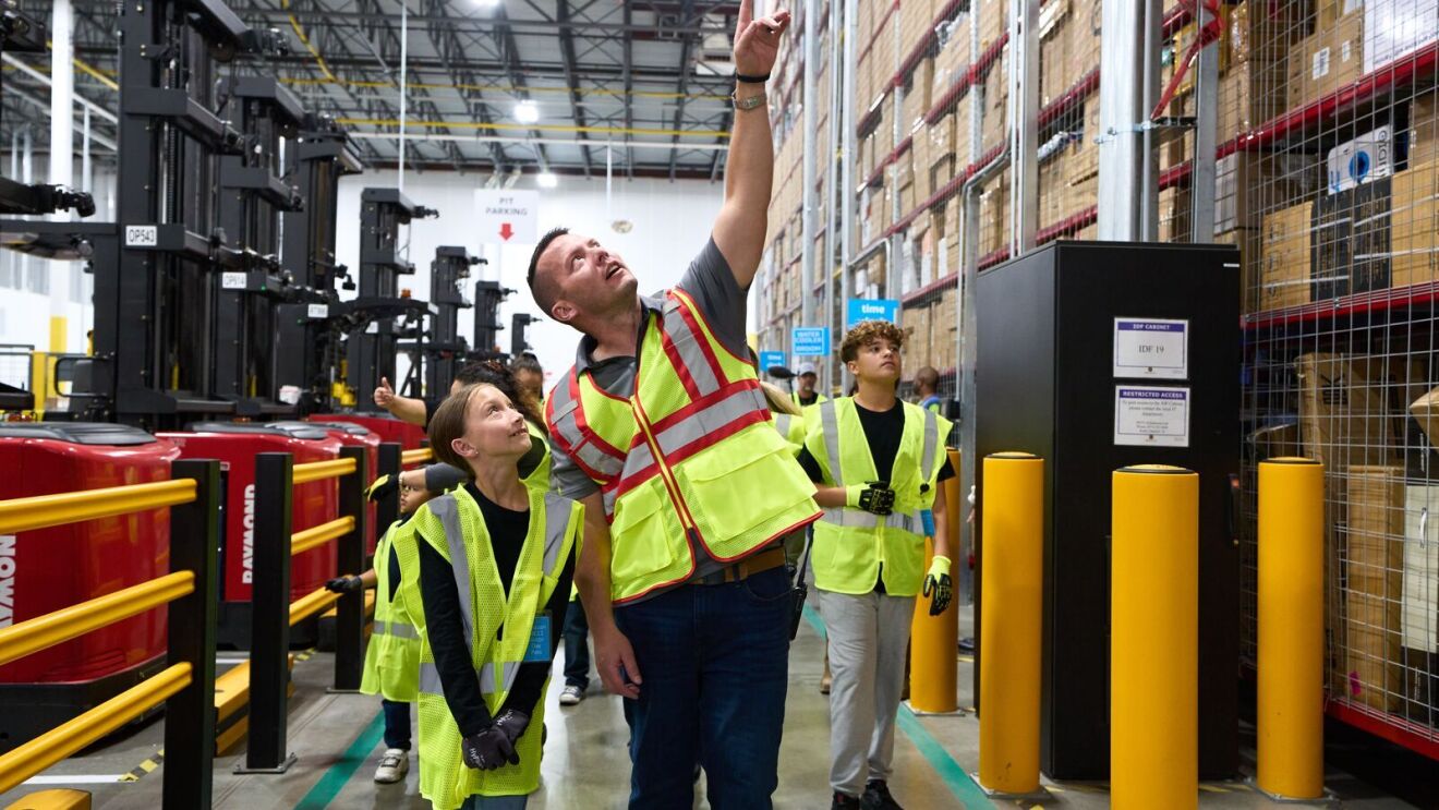 Kids join their parents at work at an Amazon Fulfillment Center.