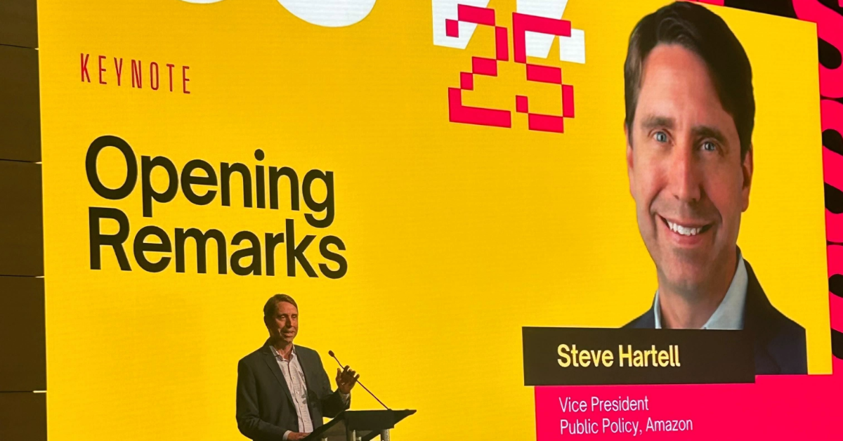 Amazon VP, Steve Hartell, giving opening remarks at technology conference podium