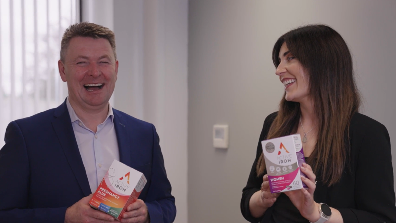 Amazon Irish sellers hold up their Active Iron supplement boxes and smile.