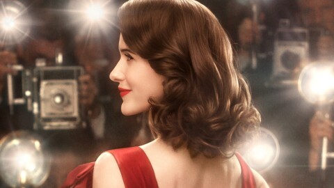 An image of Miriam (Midge) Maisel from the Marvelous Mrs. Maisel. She is on the red carpet with a lot of photographers taking pictures of her.