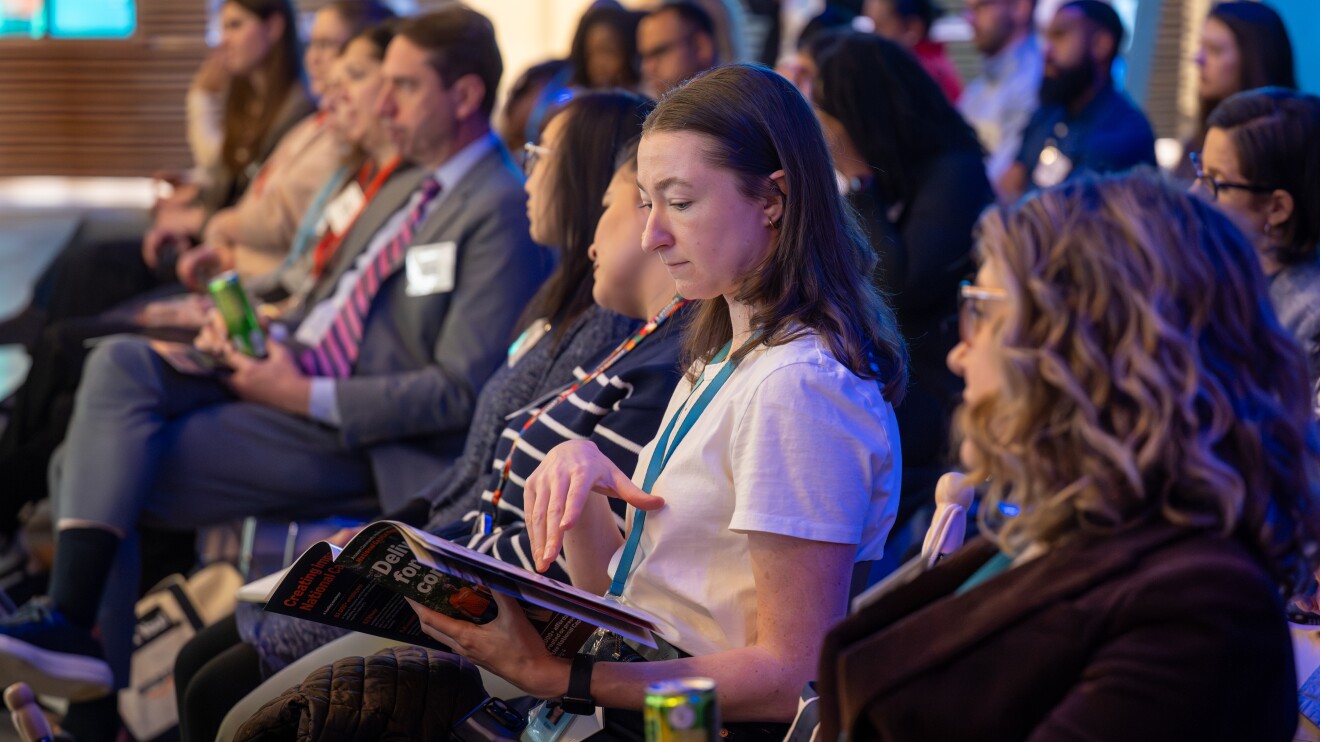 girl looking at her notes during an event 