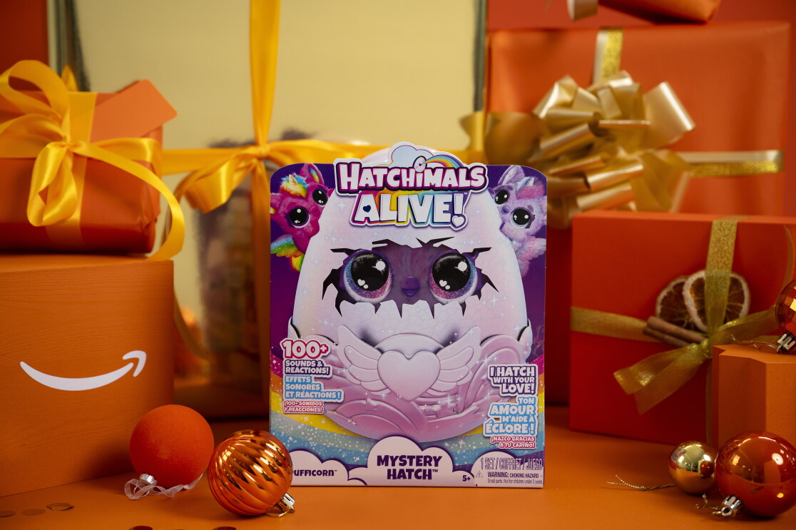 SpinMaster Hatchimals surrounded by christmas packaging 