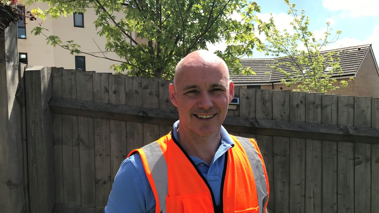 Headshot with PPE Darren Emmett