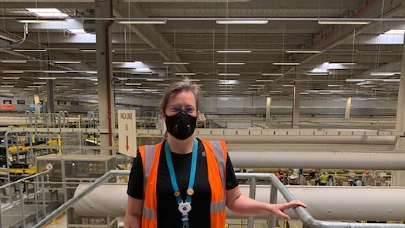 Morag Kitson, Associate at Amazon's fulfilment centre in Swansea, pictures standing on a mezzanine overlooking the shop-floor.