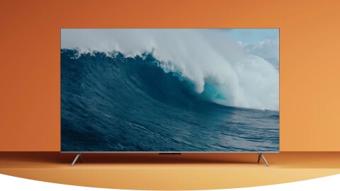 Image of a Fire TV in front of an orange background