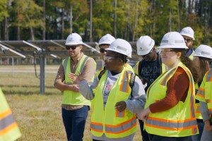 An image of a student group visiting a solar farm. 