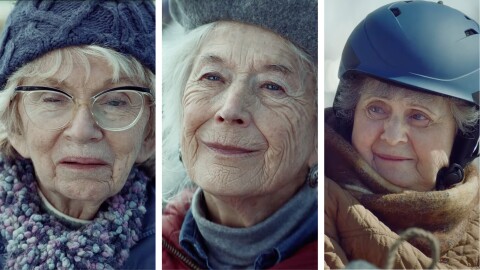 Elderly woman in winter gear with glasses and knit hat
