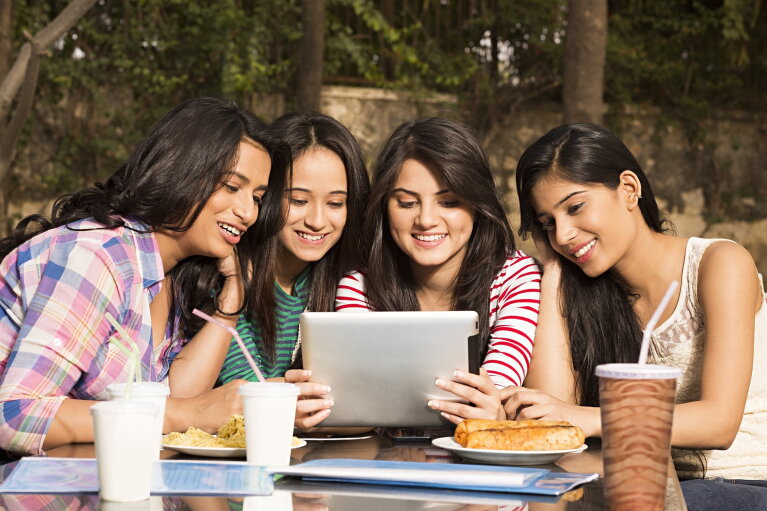 Youngsters watching a digital screen portraying Digital India