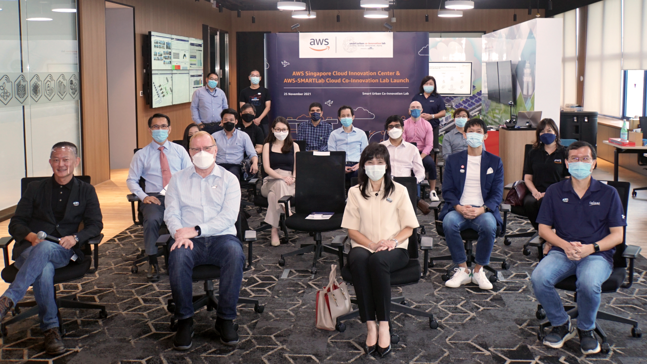 people sitting in a room with safe distancing