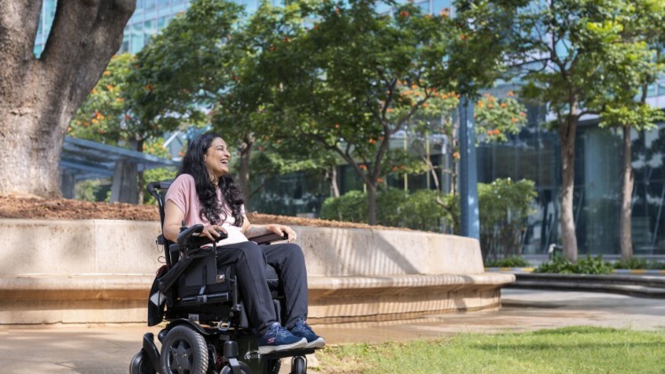 Mrunmaiy Abroal, a PR Manager on the Devices team in India and President of the PWD India Affinity group, smiles for a photo outside of the Amazon building in Bangalore, India. 