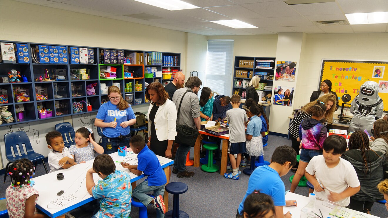 A photo of students, teachers, and the superintendent inside a new Thing Big Space classroom at River Oaks Elementary School.