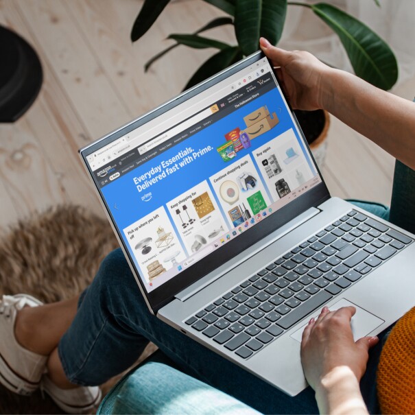 Person browsing Amazon's Everyday Essentials page on laptop
