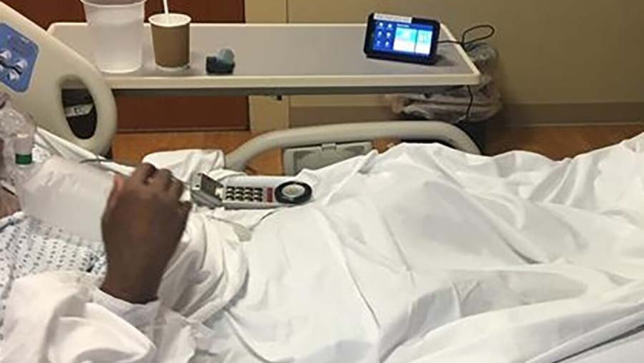 A child in a hospital bed engages with an Echo Show devices.