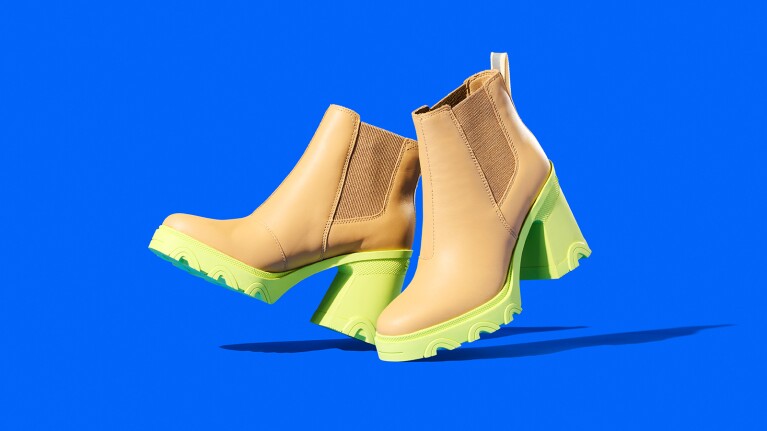 Stylish ankle boots with tan leather uppers and neon green soles