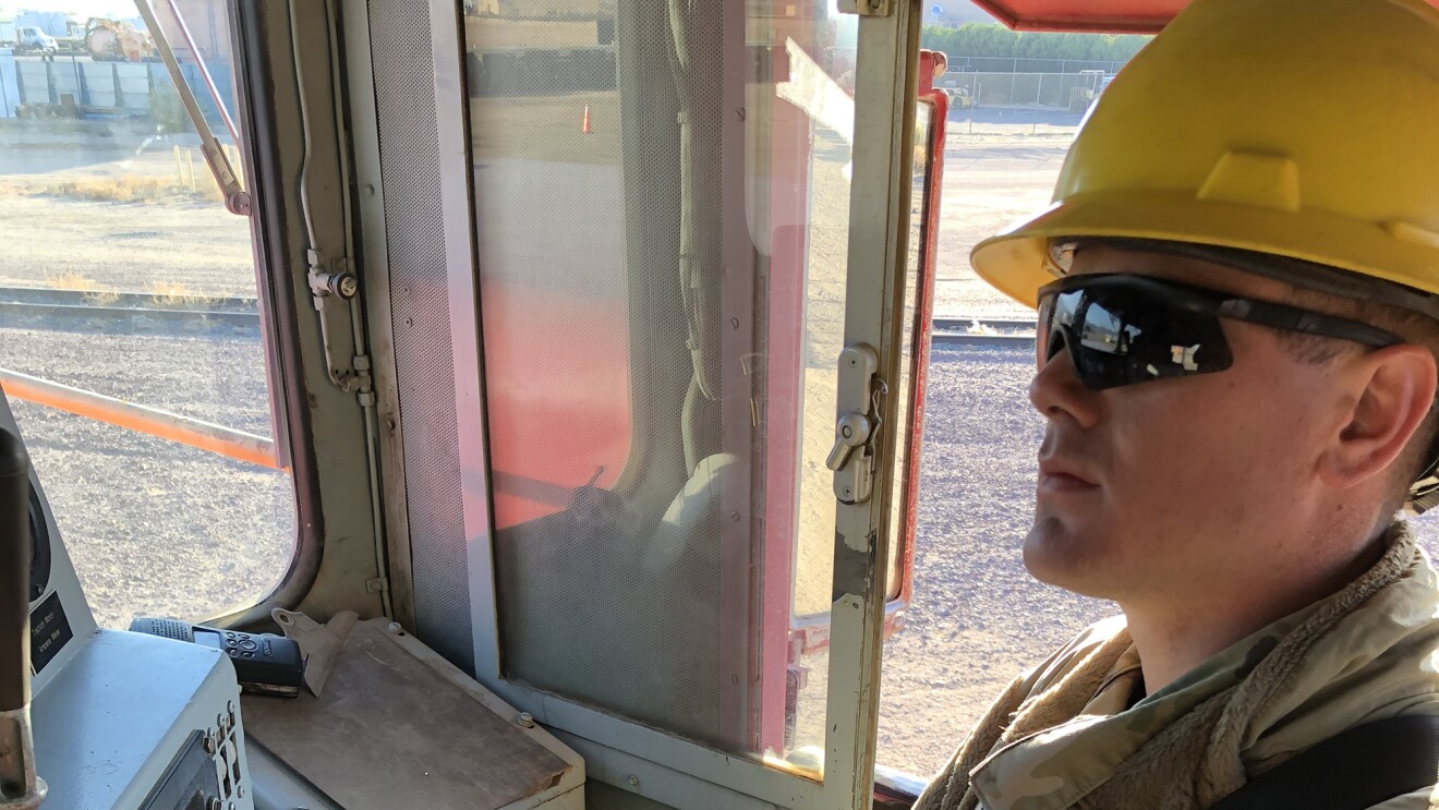 A man wearing a National Guard uniform in a military setting
