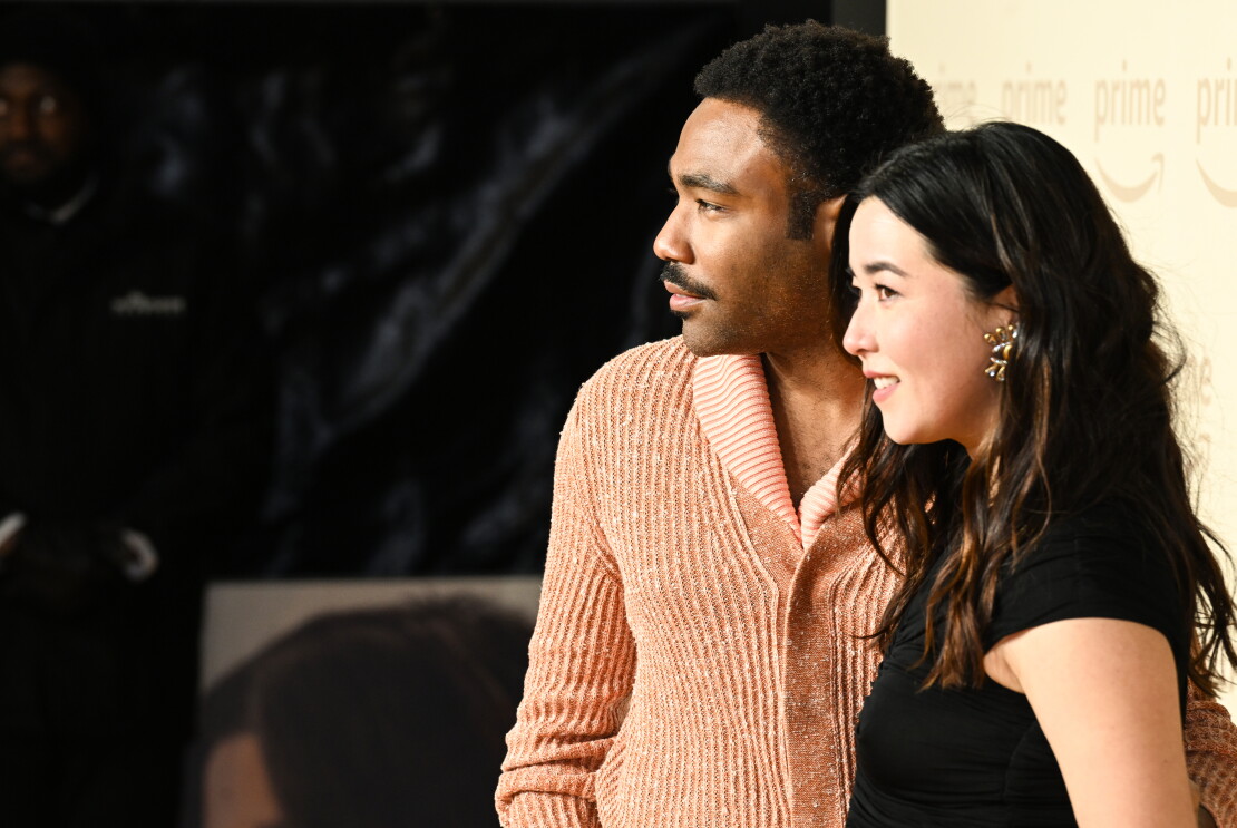 Maya Erskine and Donald Glover taking pictures