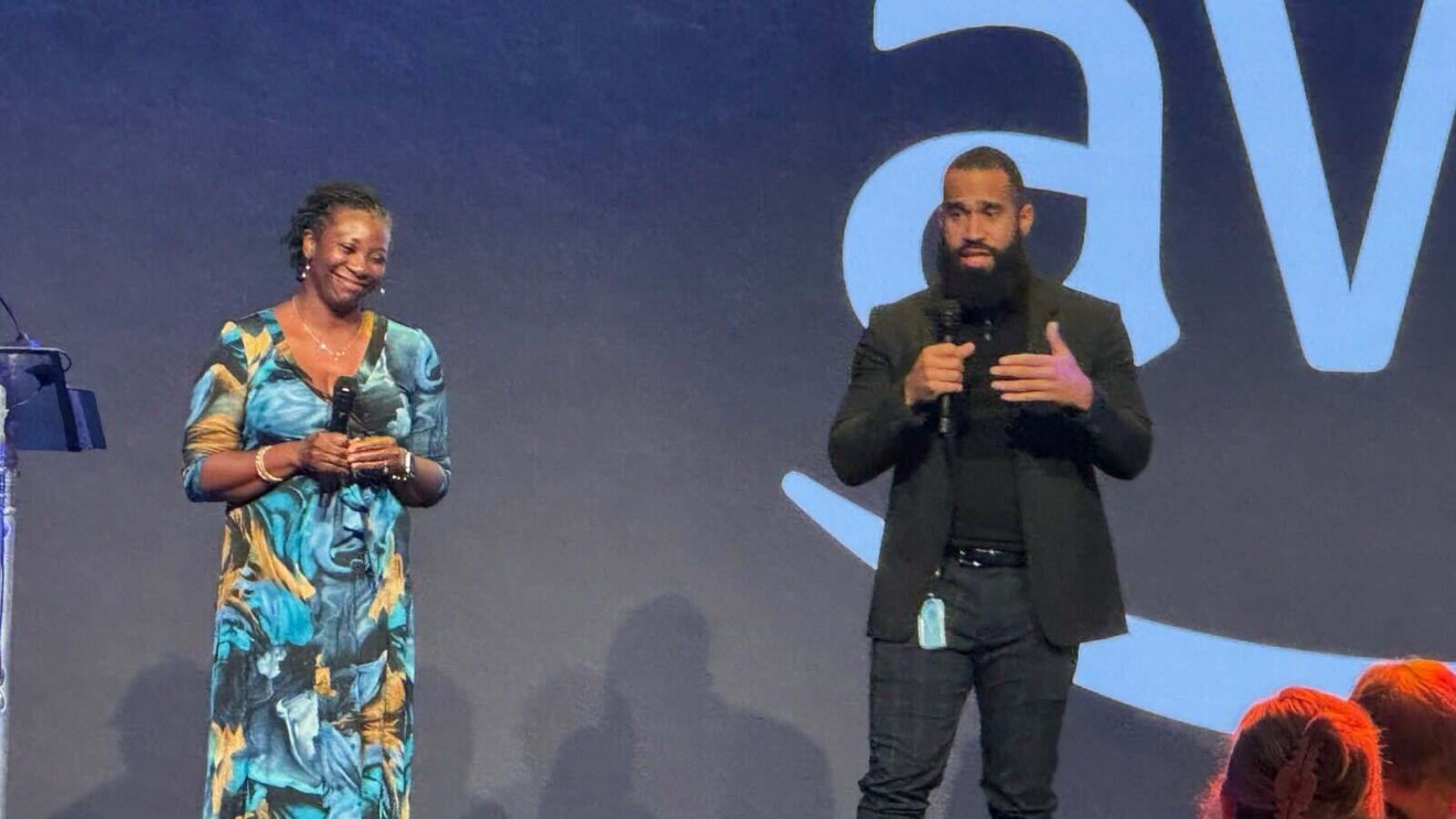 BEN-DMV hosts third annual 'Great Big Kid' event: Presenters addressing audience from podium, contrasting outfits and styles