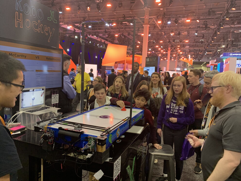 GetIT students playing air hockey at re:Invent event in Las Vegas