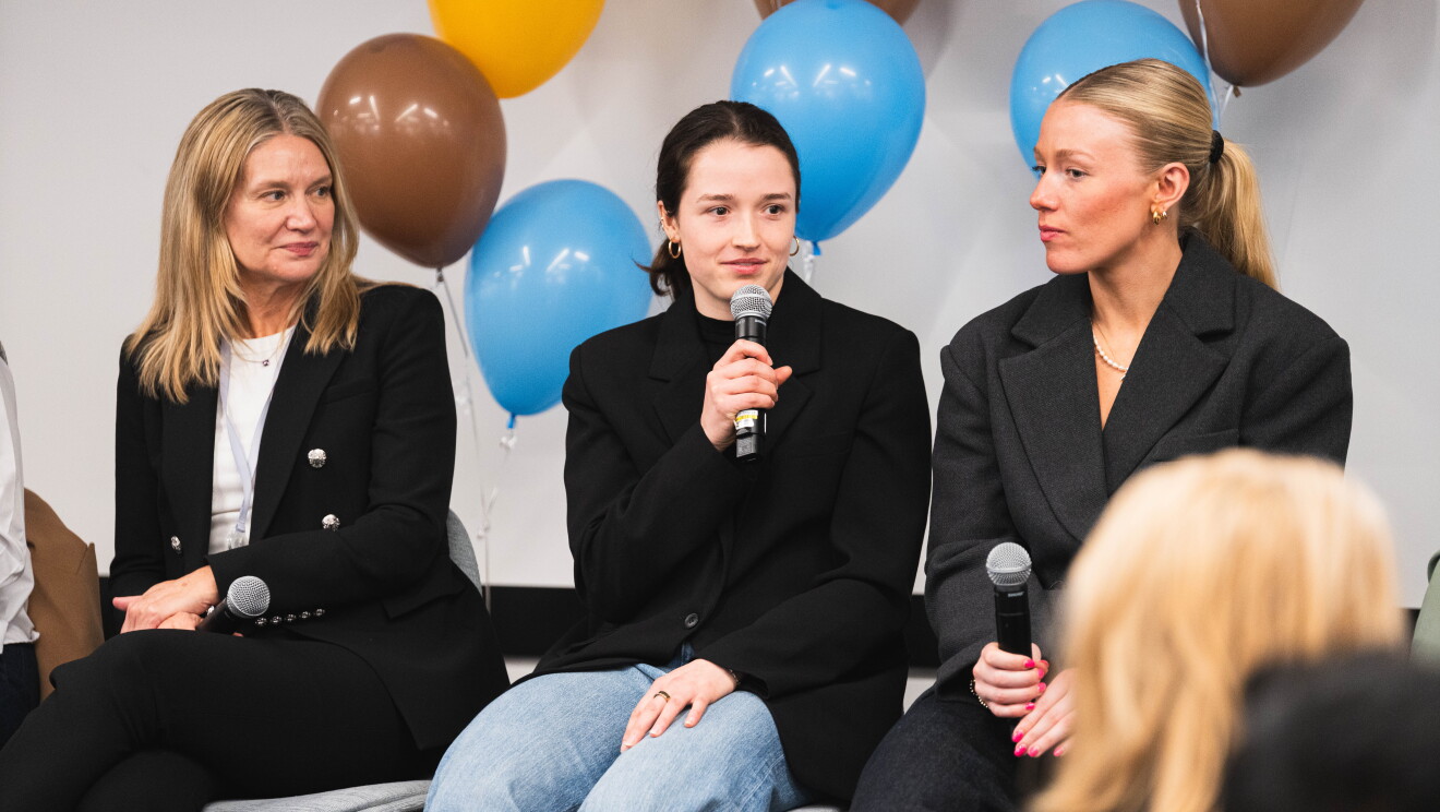 women speaking at event 