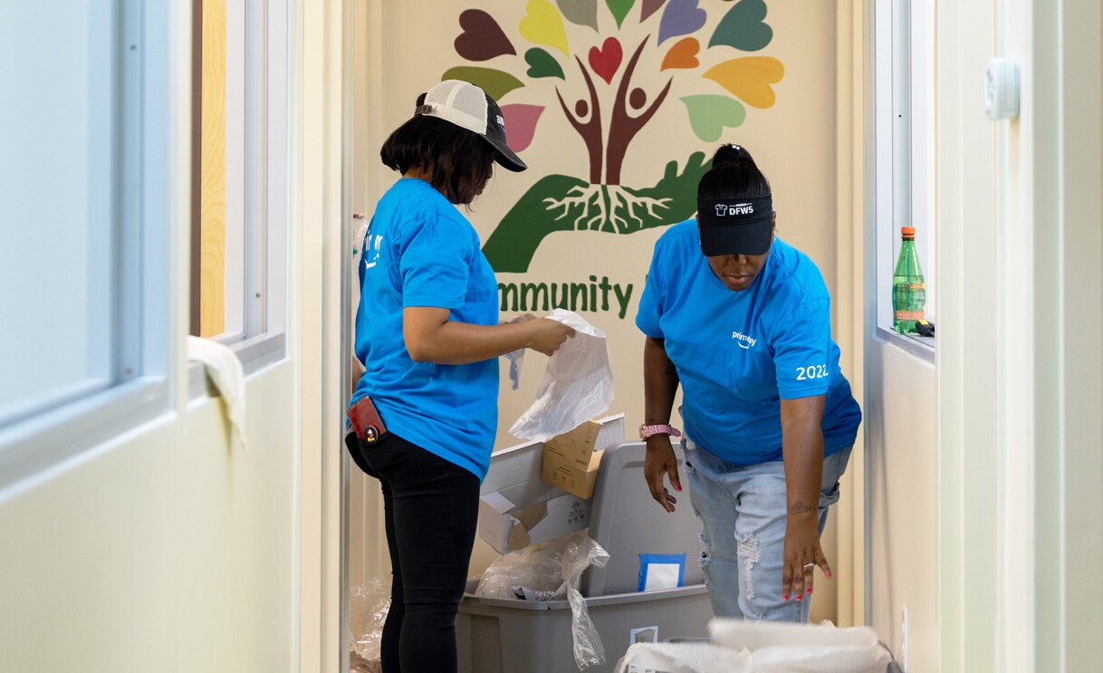 Amazon employees surprise nonprofits and schools with donations of various items.