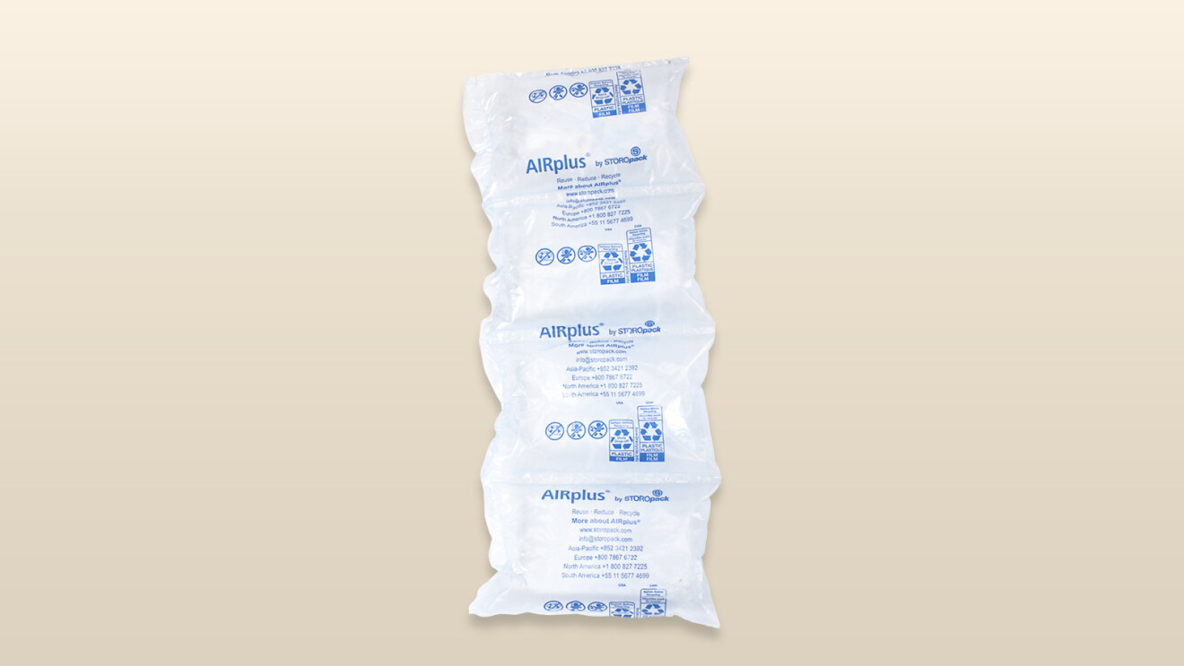An image of an amazon package with a beige background.