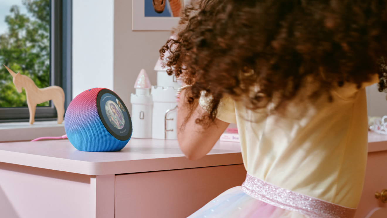 Amazon Kids Echo Time on a desk interacting with a child.