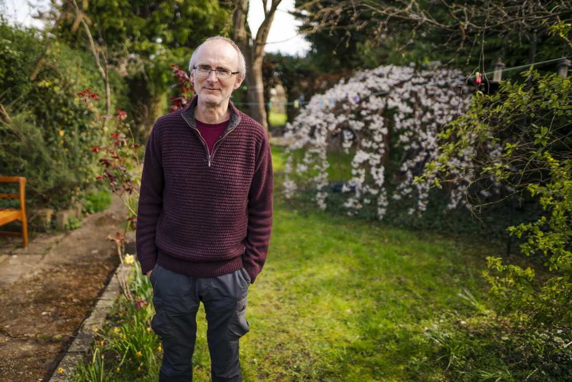 Portrait of Andrew Trehearne, who is taking part in UK Biobank's Long Covid research, in his garden