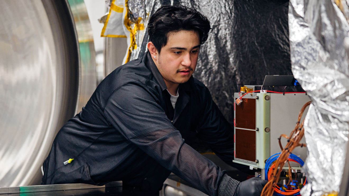 A technician working on Project Kuiper equipment. 