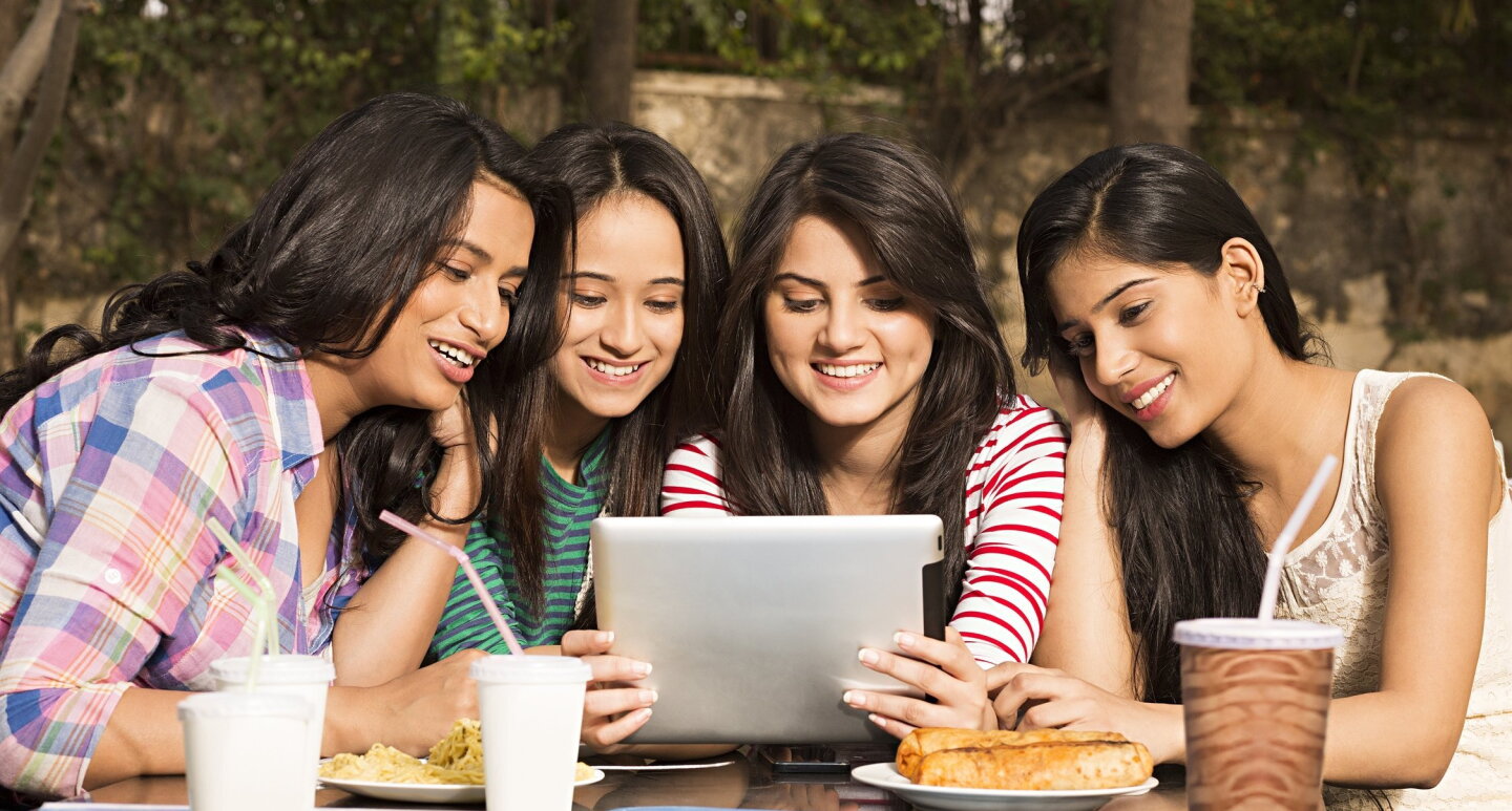 Youngsters watching a digital screen portraying Digital India