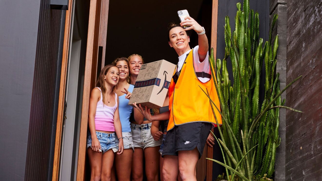 Mackenzie Arnold taking a wefie with fans as she delivers packages for Amazon Flex.