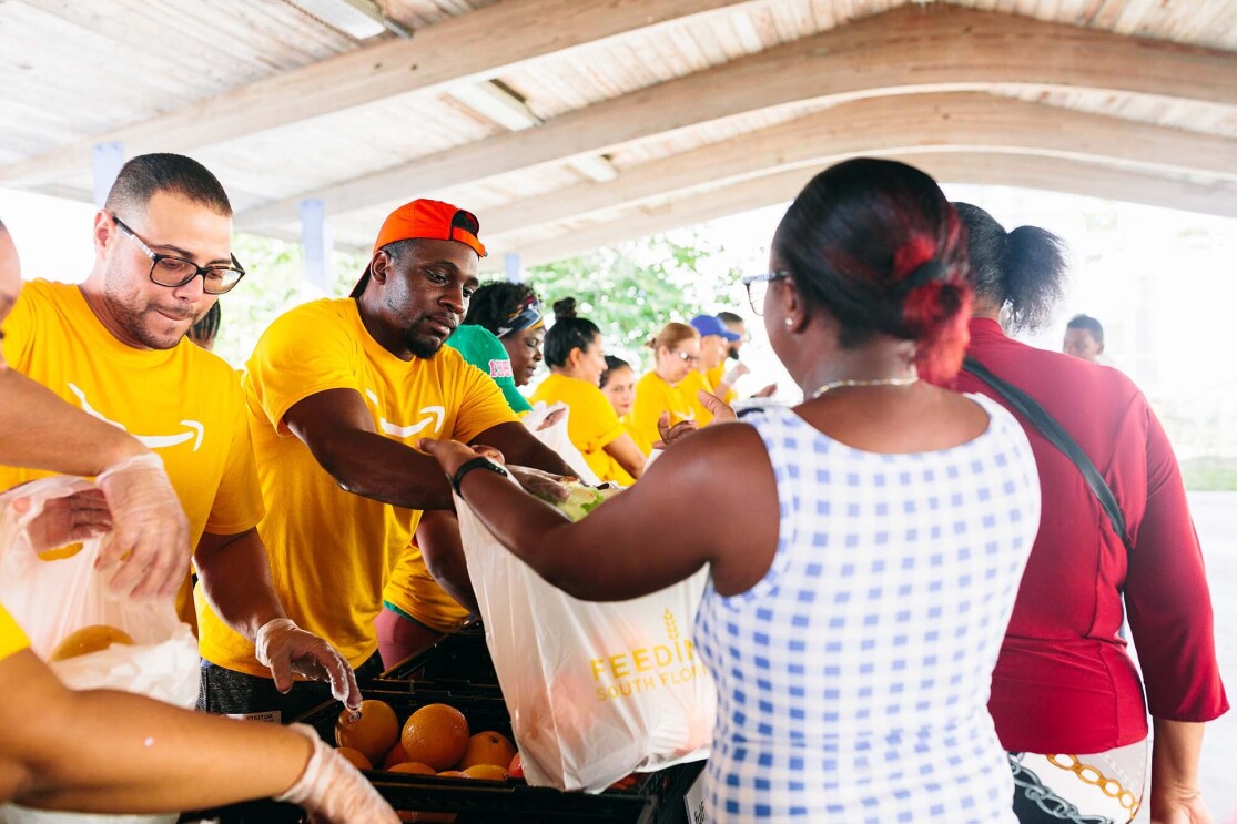 Amazon associates from Miami volunteered with Feeding South Florida and Robert B. Ingram Elementary School to support food-insecure families. 