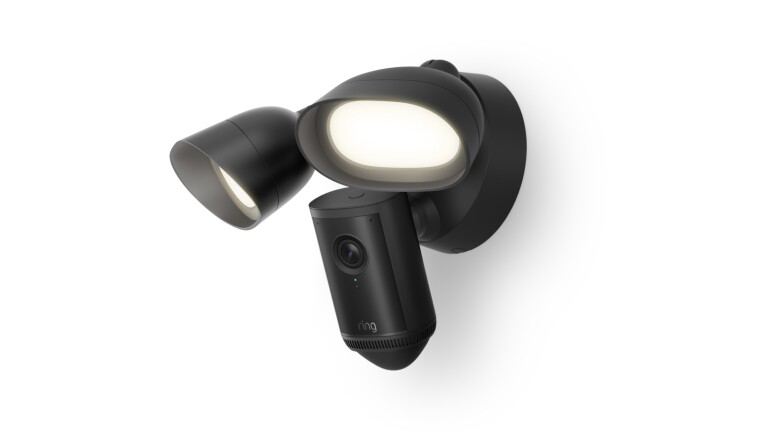 Floodlight Cam Pro at and angle facing down with the lights on.