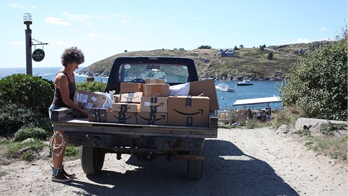 Amazon packages travel by boat, vehicle, and are delivered directly to customers.