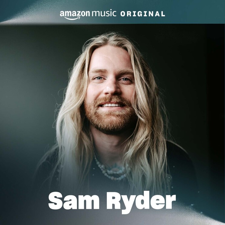 The cover art for Sam Ryder's song. It features a portrait of him smiling with a black background behind him.