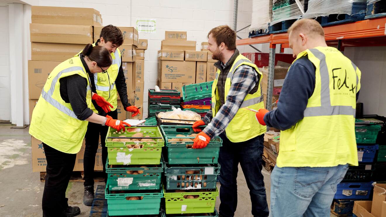 Volunteers work to distribute food for The Felix Project