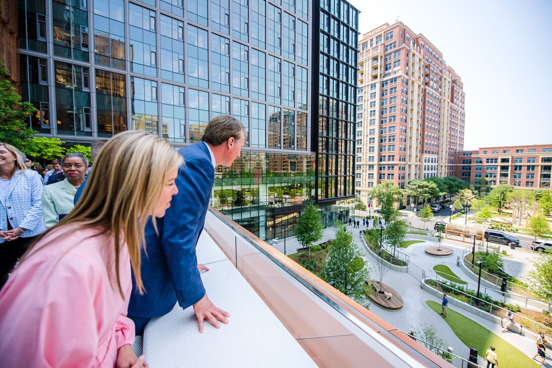 An image of local officials touring Amazon's second headquarters on its opening day