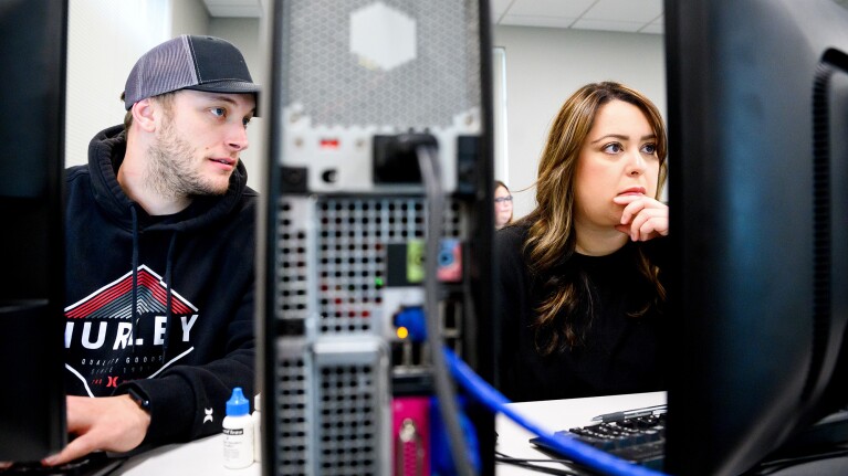 A photo of two students working on desktop computers at Blue Mountain Community College.