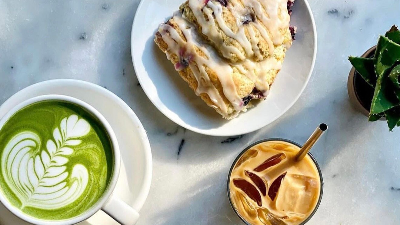 A photo of a matcha latte, scone, and iced coffee.