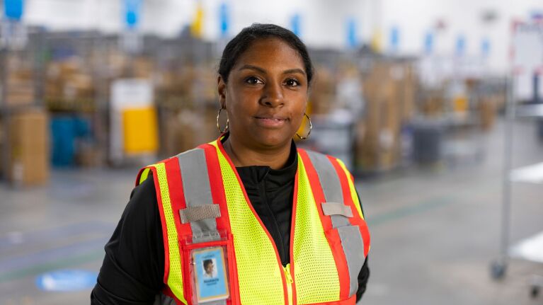 Smiling staff member in warehouse
